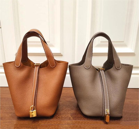 👜Bolso de piel auténtica tipo cubo con cierre de cordón y diseño de minicierre.